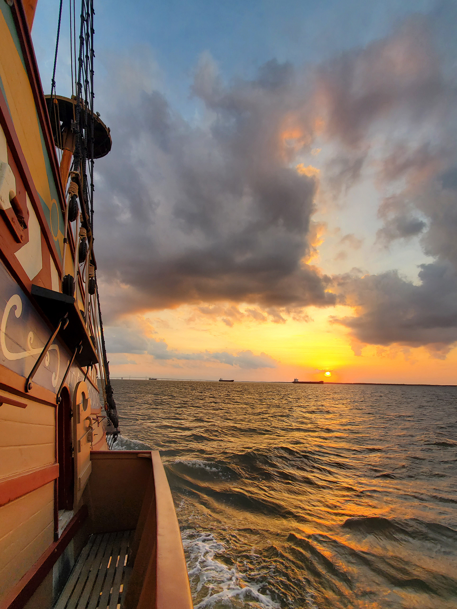 Chesapeake Bay sunrise near Annapolis with Chesapeake Bay Bridge in the background. Jamestown-Yorktown Foundation photo/Eric Speth