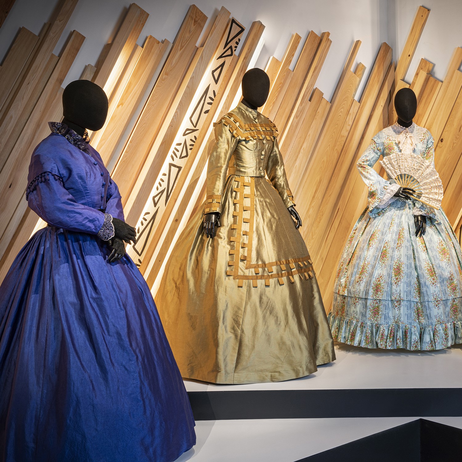 Dresses with hoop skirts from "Roots"