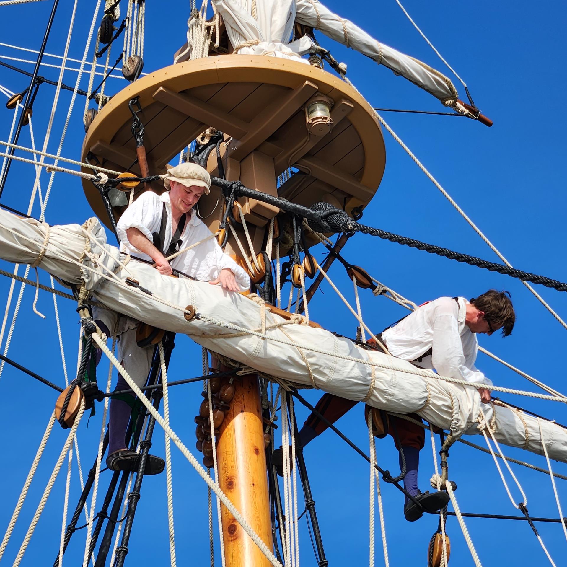 Ships crew working in the rigging