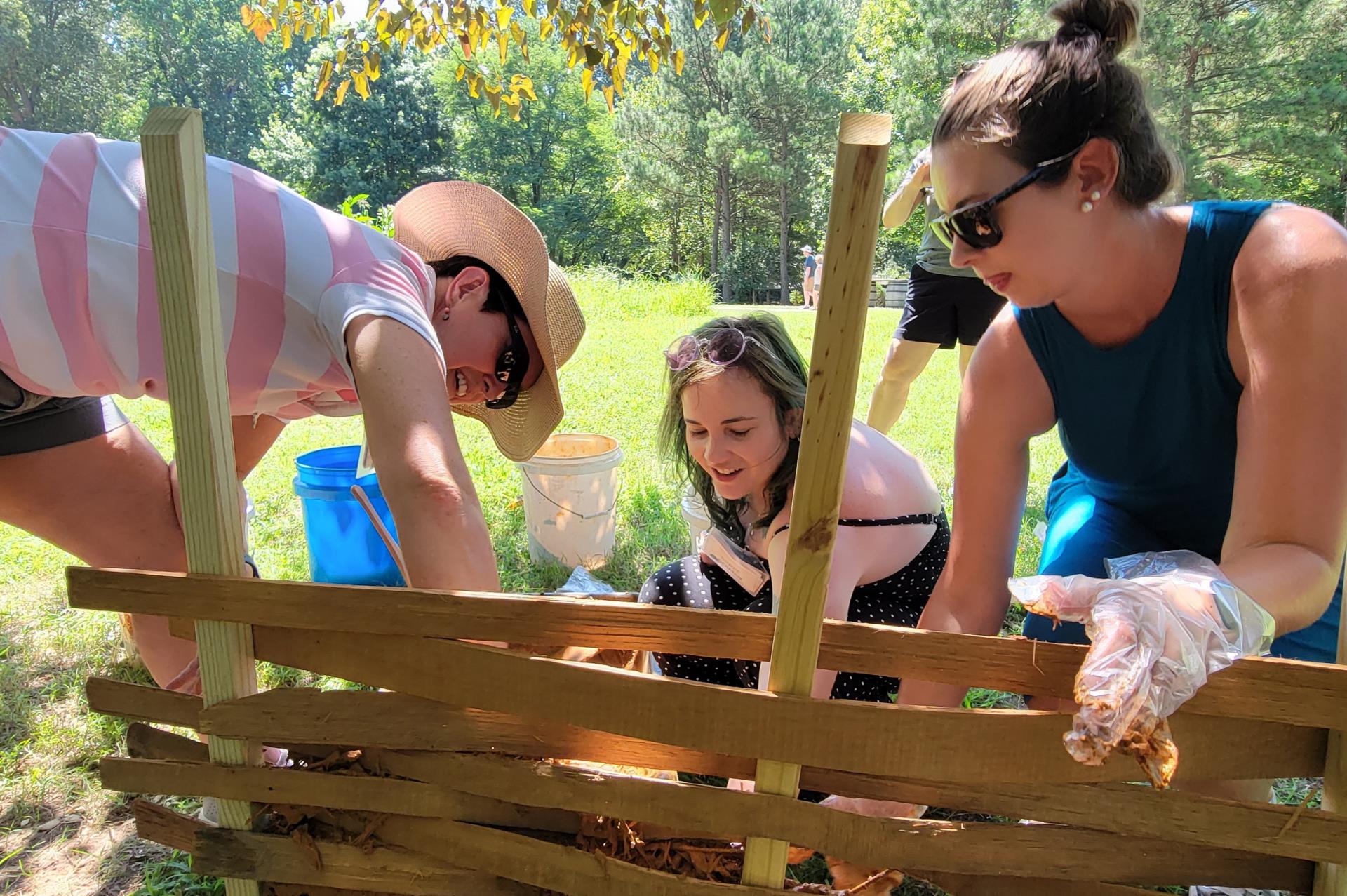 Teachers creating a wattle and daub wall at the Jamestown-Yorktown Foundation Teacher Institute