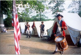 Drummer in encampment