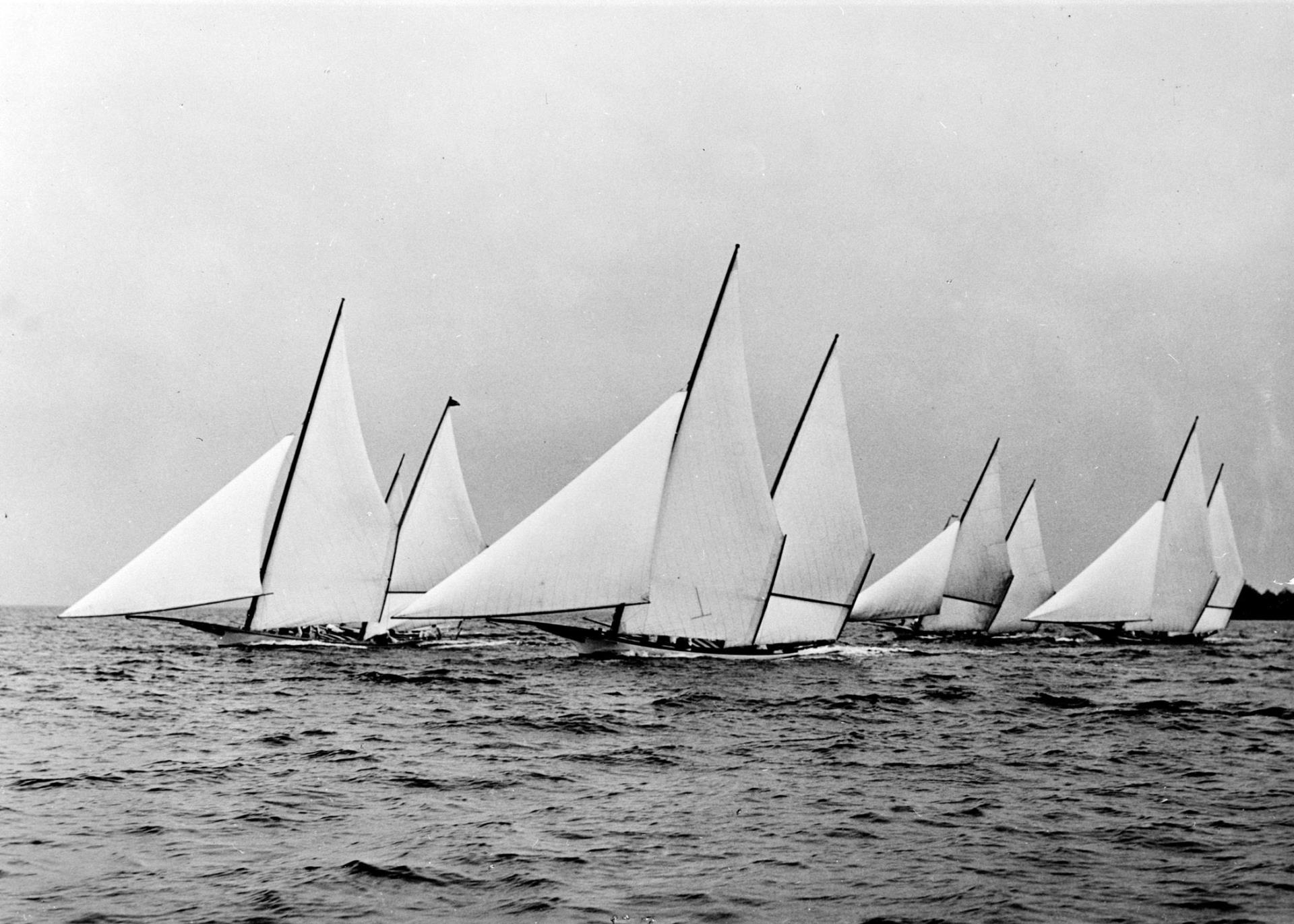 Circa-1945 photograph of a log canoe race on the Chesapeake Bay shows four vessels, from left, Magic, Flying Cloud, Mystery and Jay Dee. From the collections at The Mariners’ Museum, Newport News, Va.